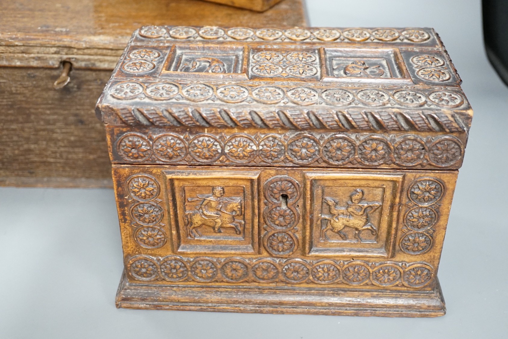 An early 18th century oak bible box containing a Victorian Morocco leather photograph album, together with two 19th century wooden boxes (4)